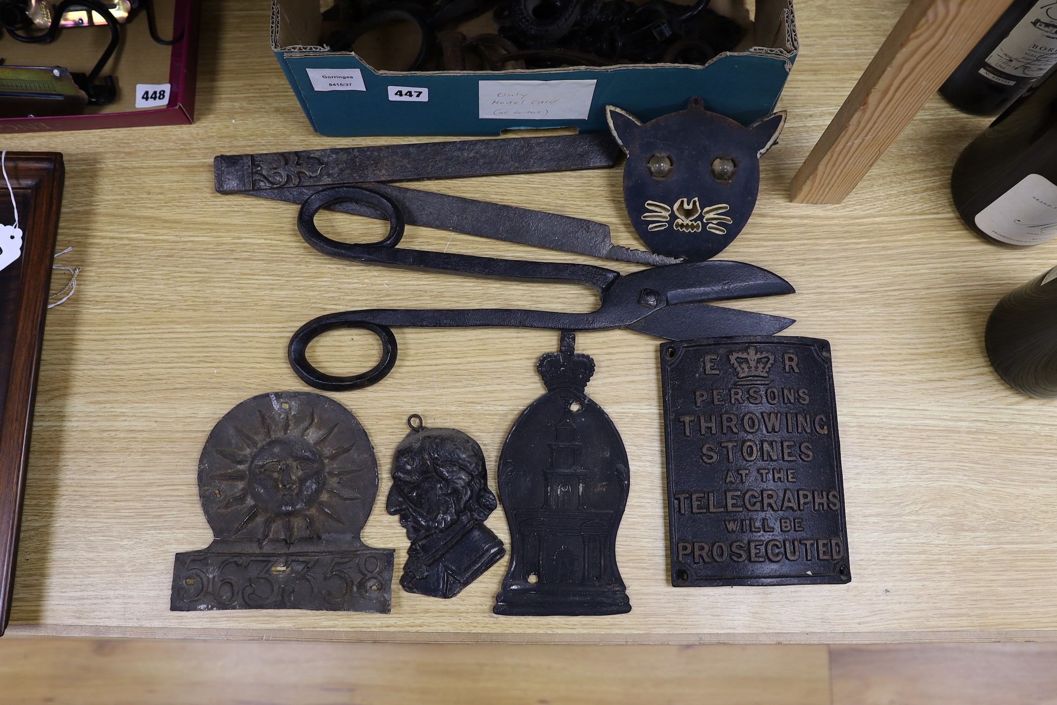 A mixed collection of iron mounts, dial elements, a trap, two fire marks etc